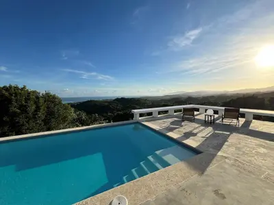 a swimming pool on top of a house with a view at Villa Mustique - Perfect tropical paradise in El Limón