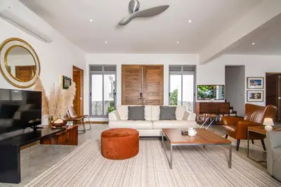 a living room with a white couch and a table at Villa Mustique - Perfect tropical paradise in El Limón