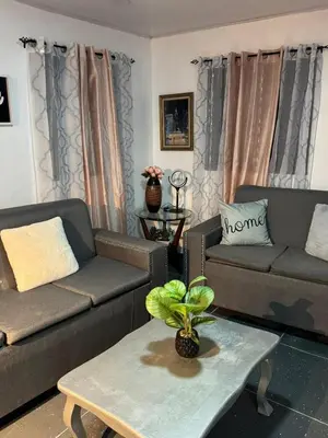 a living room with two couches and a coffee table at enjoy the nature of the countryside in Bonao