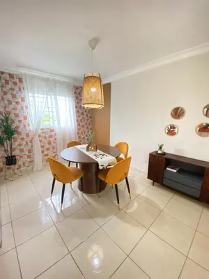 a dining room with a table and chairs at Apartamento acogedor con estilo y piscina in La Romana