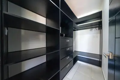 a black kitchen with black shelves and a door at Ocean View, Style, Freedom in Sosúa