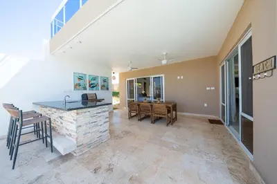 a kitchen and dining room with a table and chairs at Ocean View, Style, Freedom in Sosúa