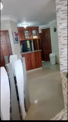a living room with a glass wall in a house at Hermoso apartamento 3 habitaciones in Los Paredones