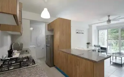 a kitchen with a stove and a counter top at Encanto en gazcue - Cerca del Malecón y la Zona Colonial in Santo Domingo
