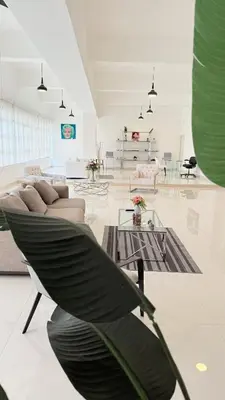 a living room with a couch and a table at Soho loft residence in Santo Domingo