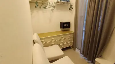 a room with a chair and a dresser with a window at Cabarete Heartbeat Suite, 1 BR in Cabarete
