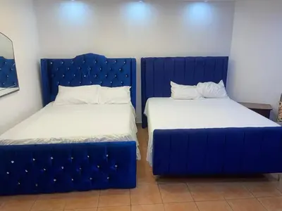 two beds sitting next to each other in a room at Vista marina apartment in Villas del Mar