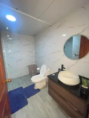 a bathroom with a toilet and a sink and a mirror at Vista marina apartment in Villas del Mar