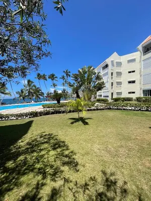 a large lawn in front of a large building at Vista marina apartment in Villas del Mar