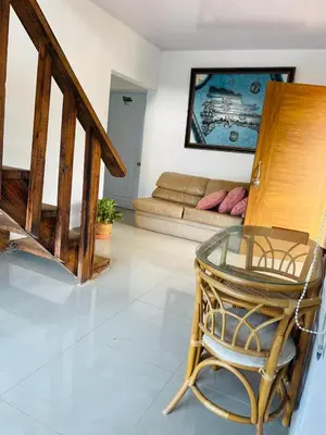 a living room with a chair and a couch at Villa de Grupo 16, Piscina Natural, Jacuzzi, Granja y Mascotas, Rosa & Deivi te esperan in Villa Altagracia