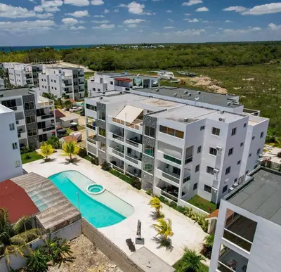 an aerial view of an apartment complex with a swimming pool at La casa del Maestro apartment in Bayahibe