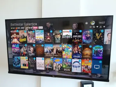 a television screen with a bunch of movies on it at Beachside Apartment with Ocean View, Garden and 2 Swimming Pools in Las Terrenas