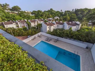 an aerial view of a villa with a swimming pool at Beachside Apartment with Ocean View, Garden and 2 Swimming Pools in Las Terrenas