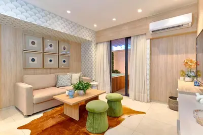 a living room with a couch and a table at ®{Peaceful~Retreat} @DowntownSD HotTubGymFamily in Santo Domingo