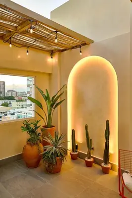 a lobby with potted plants and a large window at ®{Tulum~Experience}@Downtown PoolViewPenthouse in Santo Domingo