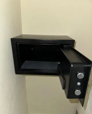 a black paper towel dispenser on a wall at Apartamento en Boca Chica T3 602 in Boca Chica