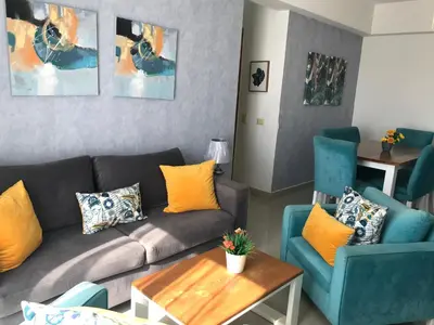 a living room with a couch and two chairs at Apartamento en Boca Chica T2 501 in Boca Chica