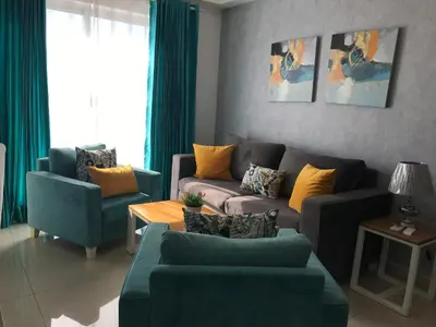 a living room with a couch and two chairs at Apartamento en Boca Chica T2 501 in Boca Chica
