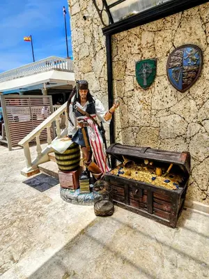 a woman standing next to a tank of fish at NEW Luxury at Sosua Ocean Village Laguna City in Sosúa
