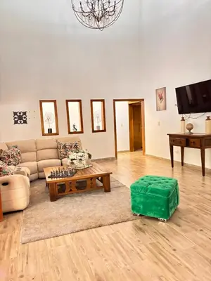a living room with a couch and a coffee table at Villa escondida in San Cristóbal