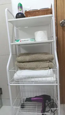 a white rack with towels and towels in a refrigerator at Comfort, safety and close to everything in Los Paredones