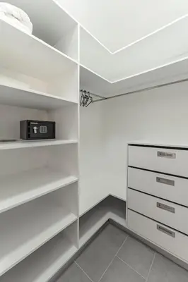 a white closet with white shelves and a microwave at Privacy, Big, Exclusive in Sosúa in Sosúa