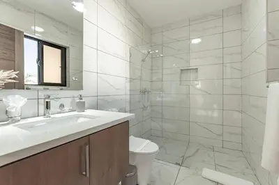 a white bathroom with a sink and a toilet at Privacy, Big, Exclusive in Sosúa in Sosúa