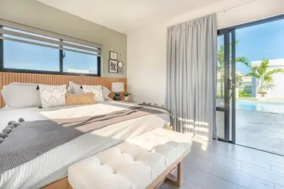 a bedroom with a large bed and a large window at Privacy, Big, Exclusive in Sosúa in Sosúa
