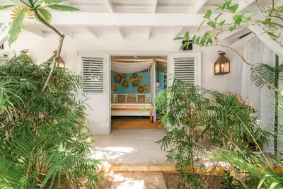 an entrance to a house with plants in theoyer at Mahona Boutique Hotel in Las Terrenas