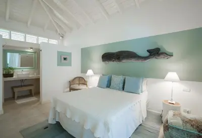 a bedroom with a bed and a sink in it at Mahona Boutique Hotel in Las Terrenas