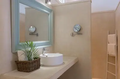 a bathroom with a sink and a mirror at Mahona Boutique Hotel in Las Terrenas