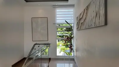 a staircase in a house with a window at Beach House With Private Pool in Las Terrenas