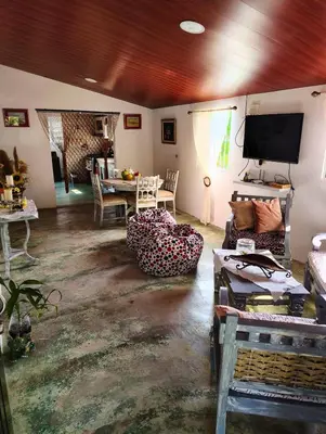 a living room with a couch and a tv at Country house with Jacuzzi and BBQ