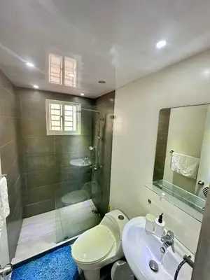a bathroom with a shower and a toilet and a sink at Modern, Elegant & Comfortable Apartment in El Seis
