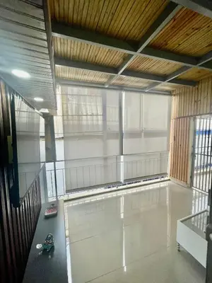 a large empty room with a tennis court at La Casita De Chucho in Santiago de los Caballeros