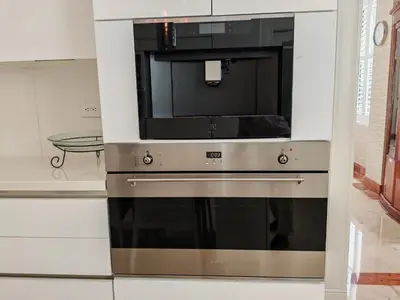 a microwave oven with a television on top of it at Casa de Campo Luxury Villa with private Pool & Jacuzzi, Near Beach, Marina, Golf, Restaurants & Altos de Chavon in La Romana