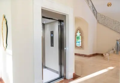 a glass door in a hallway with a staircase at Casa de Campo Luxury Villa with private Pool & Jacuzzi, Near Beach, Marina, Golf, Restaurants & Altos de Chavon in La Romana