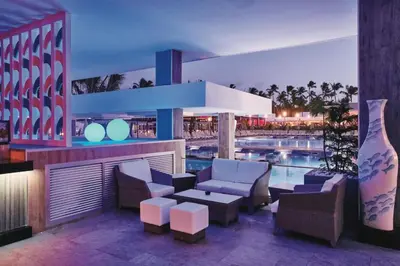 a view of a resort with a pool at night at Riu Bambu - All Inclusive in Punta Cana