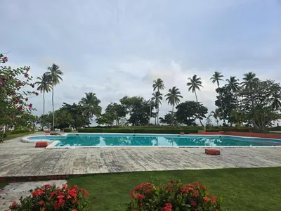 a swimming pool with palm trees in the background at Rest in Paradise, Pool, Beach and Terrace in Sánchez