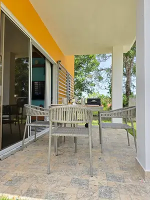 two chairs and a table on a patio at Rest in Paradise, Pool, Beach and Terrace in Sánchez