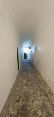 an empty hallway of an empty room with a tunnel at Hostel capicua in Punta Cana