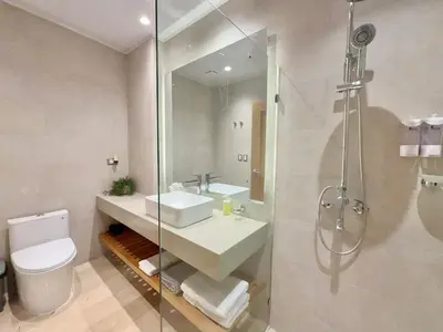 a bathroom with a sink and a shower and a toilet at Stylish Studio Samaná Bay View, Pool and Gym Access in Santa Bárbara de Samaná