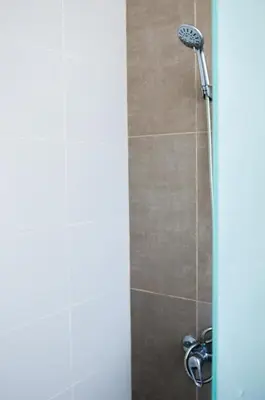 a shower with a shower head in a bathroom at Art Villa Dominicana in Punta Cana