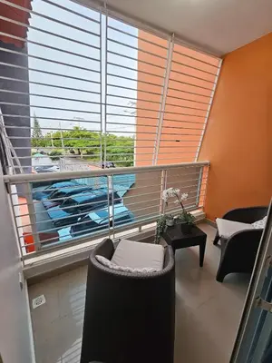 a room with a large window with a view of a marina at Luxury apartment in Santo Domingo Este in Juan López
