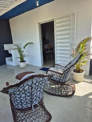 two chairs and a table on a patio at OMY Apartments Nagua 2A in Nagua