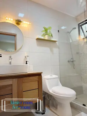 a bathroom with a toilet and a sink and a shower at Beachfront apartment Sunset in Colorado