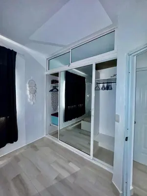 a living room with a large glass wall at Greta's Penthouse Bayahibe in Bayahibe