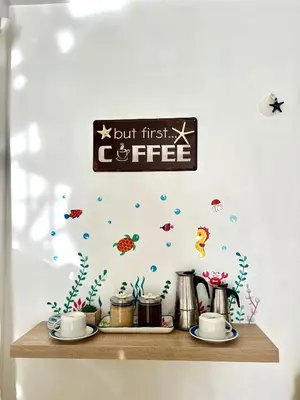 a sign for a coffee shop with fish on a shelf at Apartamento a solo pasos del centro y la playa in Bayahibe