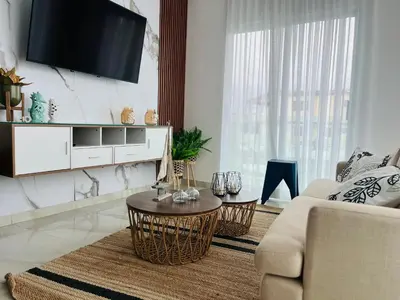 a living room with a couch and a table at The Beauty and The Beach in Nagua