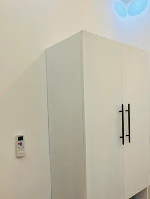 a white cabinet with two crosses on it at The Beauty and The Beach in Nagua